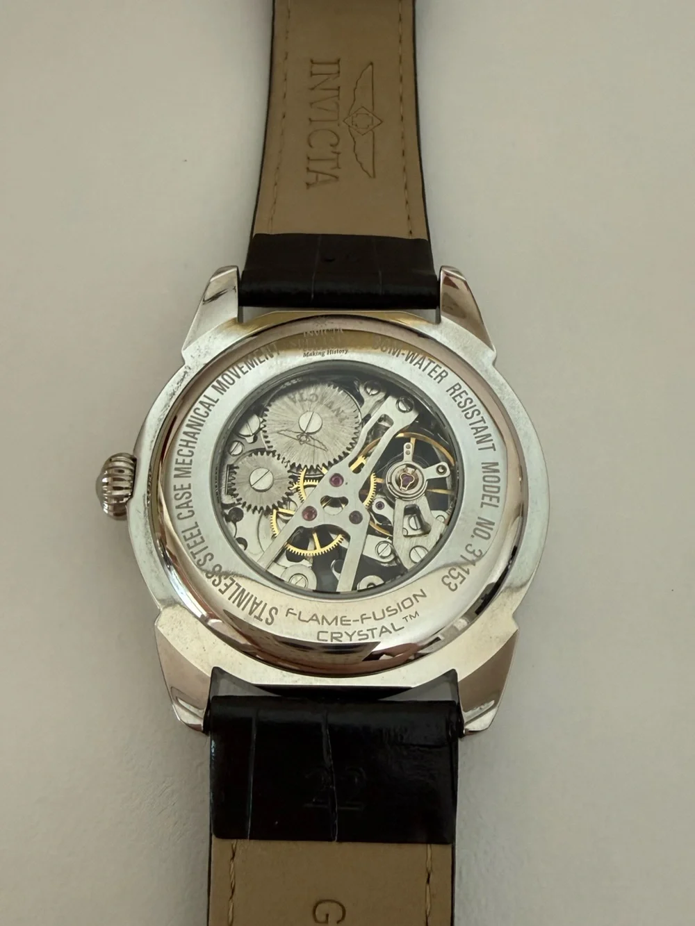 Invicta Men’s Silver Skeleton Dial Watch with Black Leather Strap